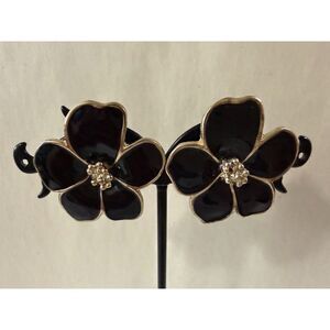 Black enamel with gold-tone outlines and centered cluster of small crystals